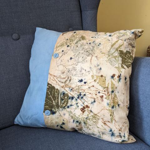 Plant dyed linen cushion on a chair