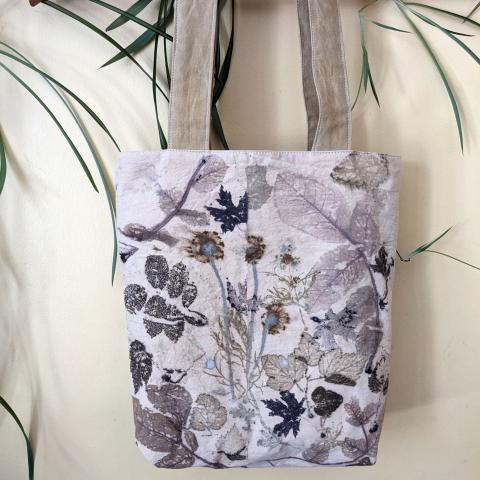 Eco-printed tote bag hanging on the wall