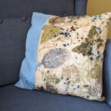 Plant dyed linen cushion on a chair